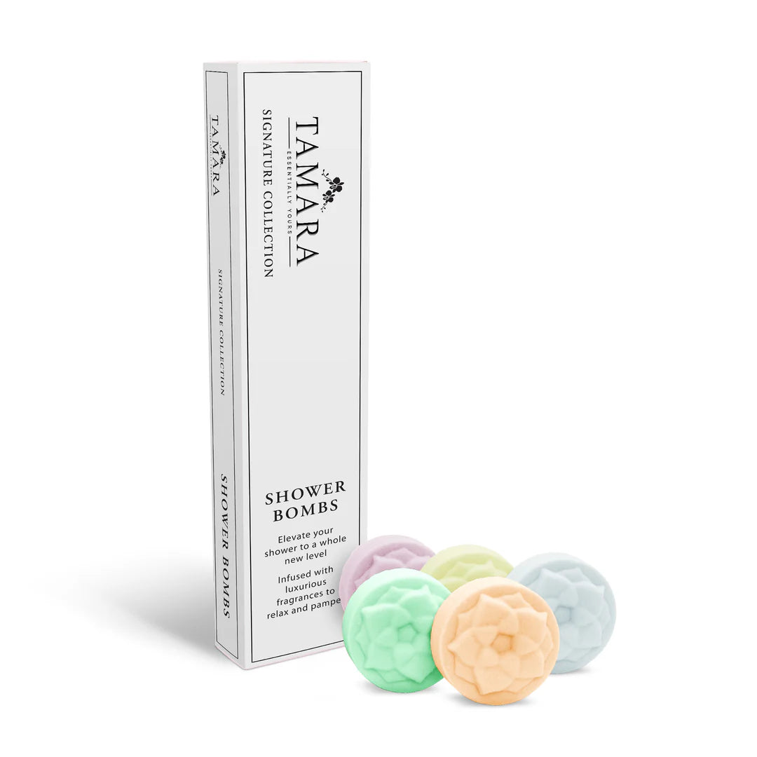 Shower bomb box with five pastel round bombs in mint, blue, and peach