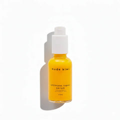 Ultimate repair serum bottle with pump; amber liquid in 30 ml glass, white cap