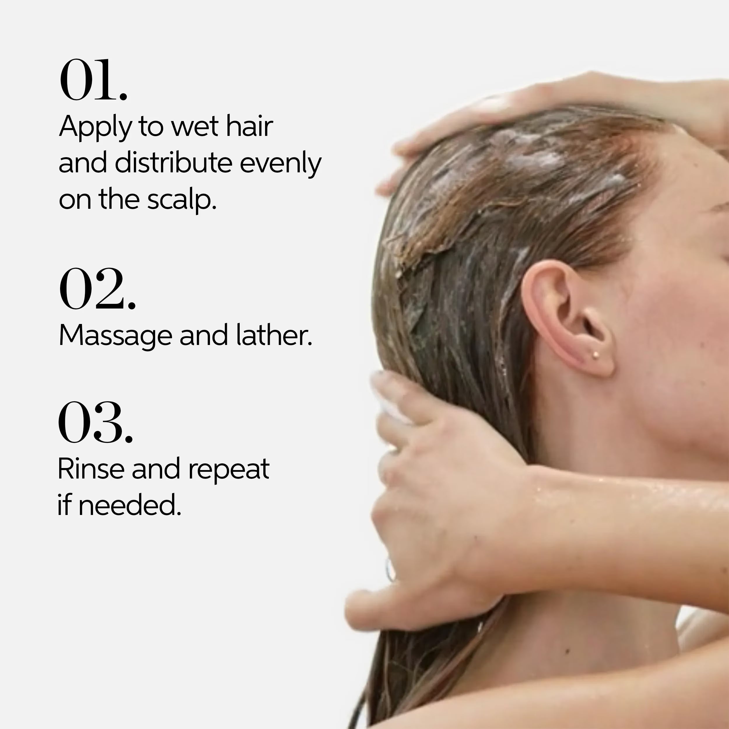 Shampoo application: hands massaging lather into wet hair