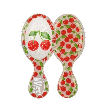 Mini detangling hair brush with cherry pattern, white red and green handle
