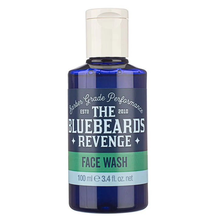 Face wash bottle close-up, blue body with white cap and "FACE WASH" label