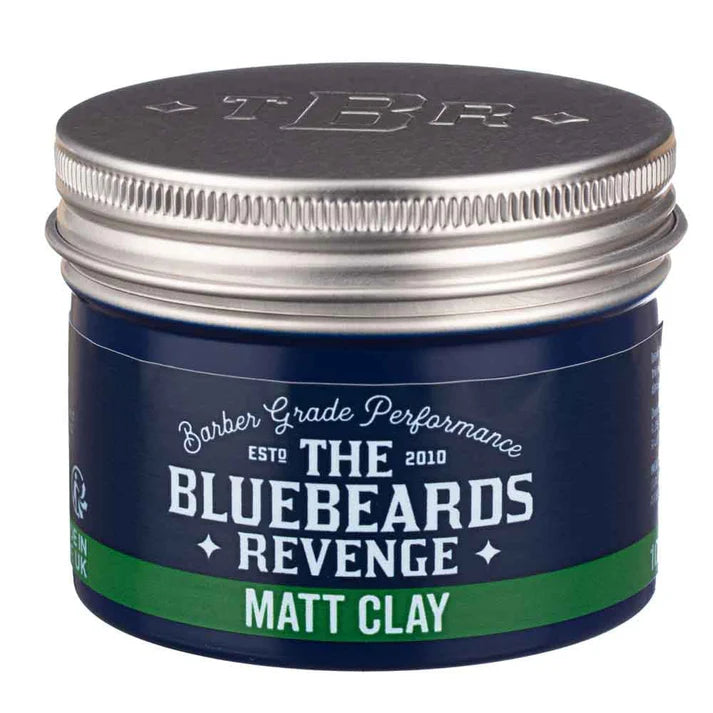 Matt clay styling jar with dark-blue front label and silver lid