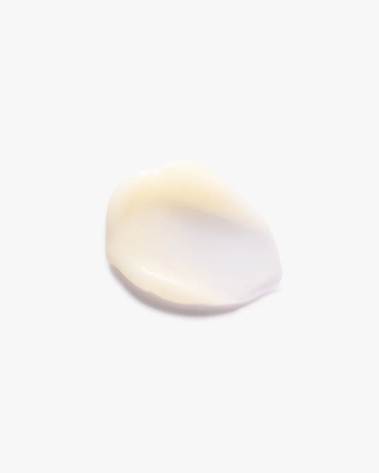 Hair conditioner cream dollop, off-white, smooth texture.