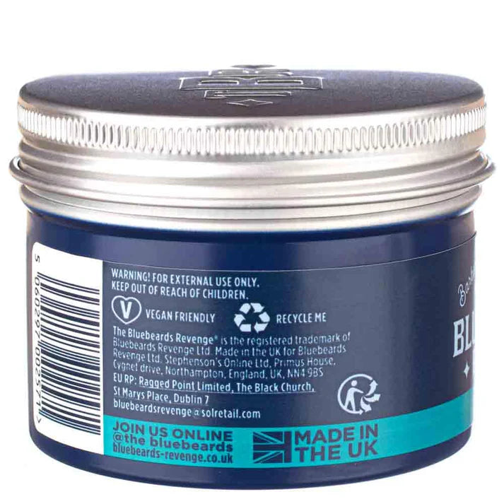 Pomade jar back label, dark blue container with warning text and UK recycle icons
