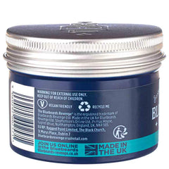 Pomade jar back label, dark blue container with warning text and UK recycle icons