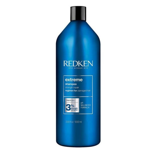Redken Extreme shampoo bottle with blue label and black pump cap, 1L