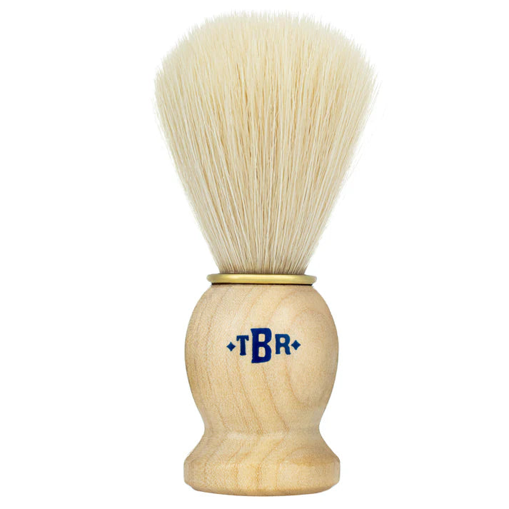 Synthetic shaving brush with pale bristles and light wood handle, *TBR* logo