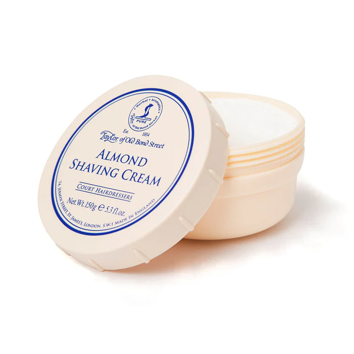 Almond shaving cream bowl with lid open, showing cream-colored product inside