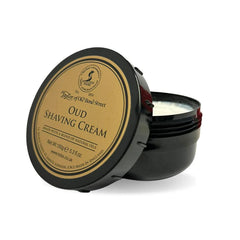 Oud shaving cream bowl: black round container with hinged lid, labeled 'OUD'.