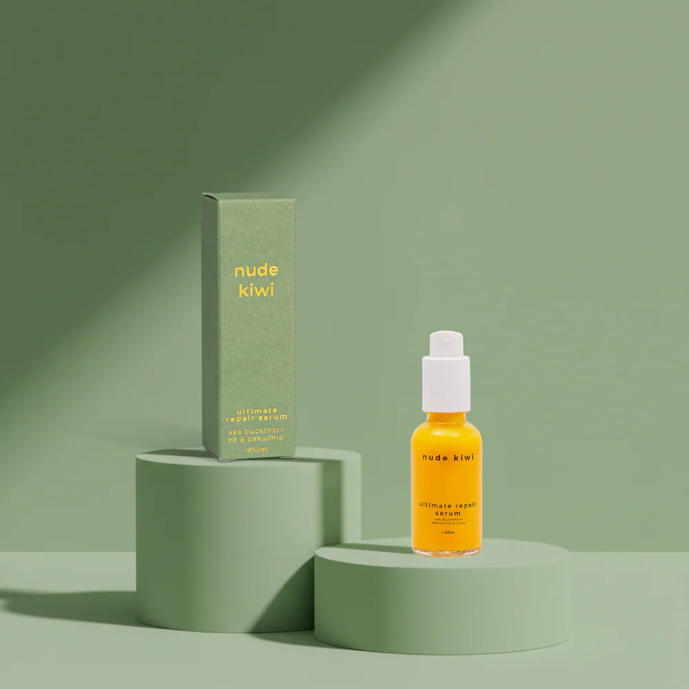 Ultimate repair serum bottle with pump; amber liquid, shown with matching product box