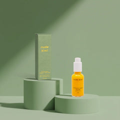 Ultimate repair serum bottle with pump; amber liquid, shown with matching product box