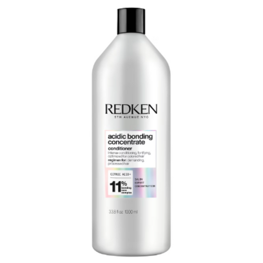 Conditioner bottle with black cap, white label reading Redken Acidic Bonding Concentrate